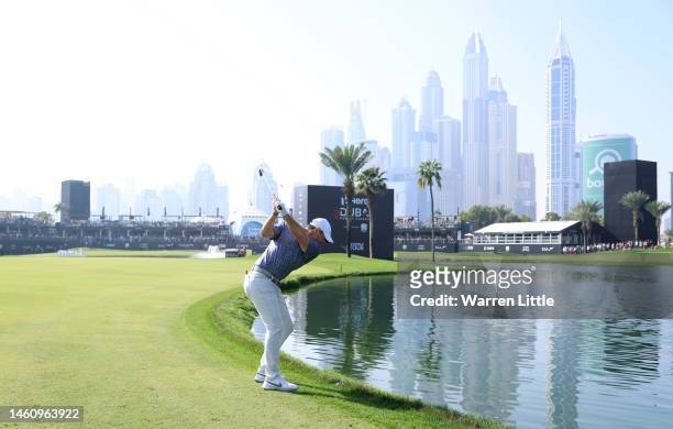 Rory McIlroy of Northern Ireland plays his second shot on the 18th hole during the final round of the Hero Dubai Desert Classic at Emirates Golf Club...