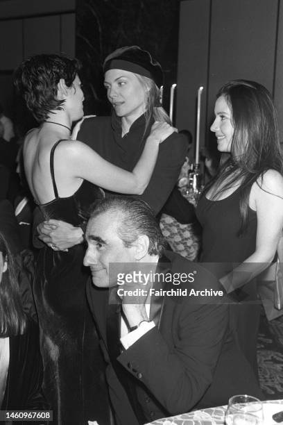 Actress Michelle Pfeiffer hugging fellow actress Winona Ryder, while director Martin Scorsese and his daughter, Dominica stand beside them at 'The...