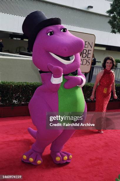Barney the big purple dinosaur attends the Golden Globe awards on January 18, 1998 in Los Angeles, California. Article title: 'Eye: Spanning the...