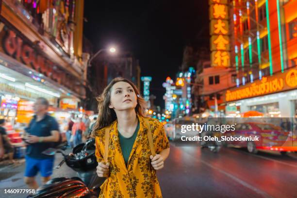 woman walking in chinatown in bangkok - gapyear imagens e fotografias de stock