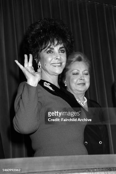 National chairwoman of the American Foundation for AIDS Research, Elizabeth Taylor, presides over the 'Art Against AIDS auction at Christie's