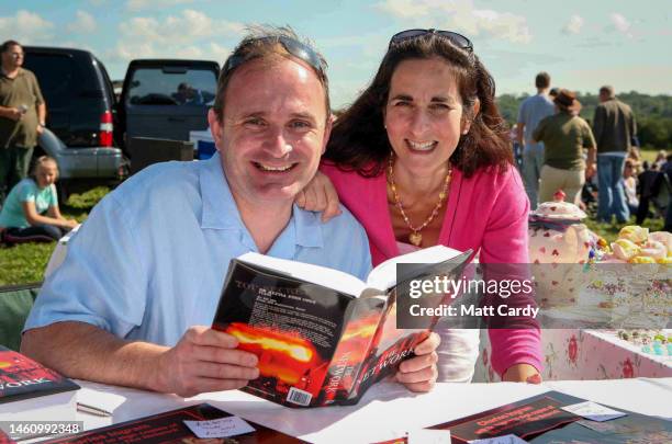 Charles Ingram and his wife Diana sell copies of his book and other merchandise at a car boot sale, on August 27, 2022 in Bristol, England. Charles...