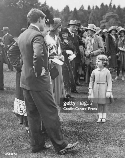 Princess Elizabeth at a garden party held at Glamis Castle in Angus, Scotland, 12th August 1931. The event is in celebration of the golden wedding of...