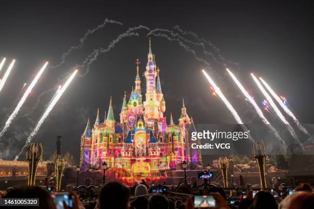 Fireworks explode in front of the Enchanted Storybook Castle at Shanghai Disney Resort on January 30, 2023 in Shanghai, China. Shanghai Disney Resort...
