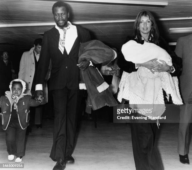 Actor Sidney Poitier with partner Joanna Shimkus and their daughters Anika and baby Sydney Tamiia wrapped in a shawl, unspecified location, 20th...
