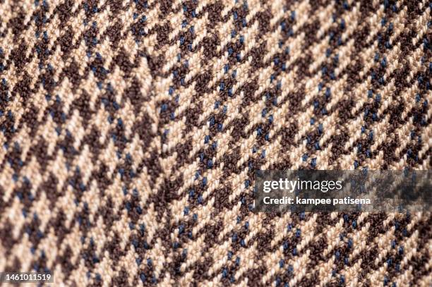 fabric swatch with hounds tooth chick pattern in brown - embellished blazer stock pictures, royalty-free photos & images