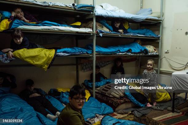 Children hide at a bomb shelter during air-raid siren on January 17, 2023 in Zaporizhzhia, Ukraine. Since the beginning of a large-scale invasion of...