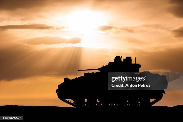 american infantry fighting vehicle on the background of the sunset sky - infantry stock pictures, royalty-free photos & images