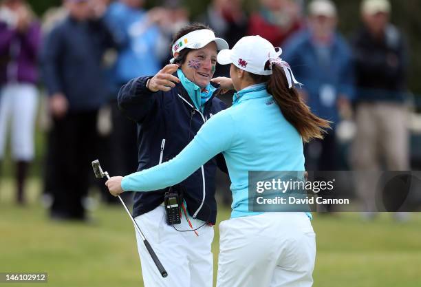 Tegwen Matthews of Walkes and captain of the Great Britain and Ireland team congratulates Kelly Tidy of England and the Great Britain and Ireland...