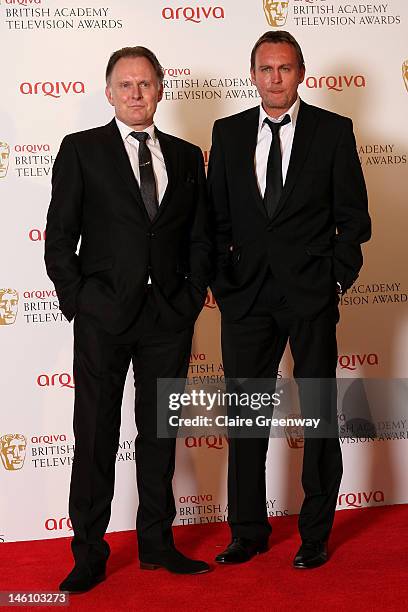 Robert Glenister and Philip Glenister pose in front of the the winners boards at The Arqiva British Academy Television Awards 2012 at The Royal...