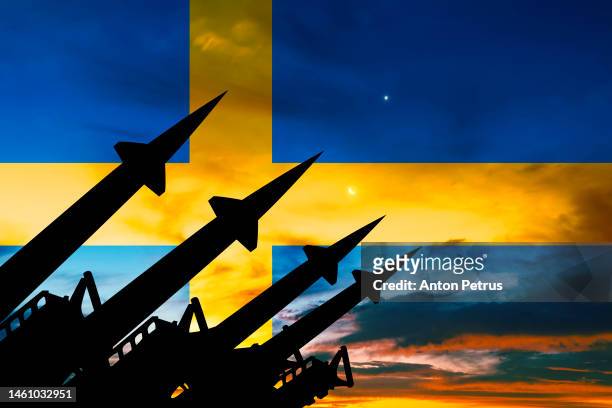 missile system on the background of the flag of sweden - zweden stock pictures, royalty-free photos & images