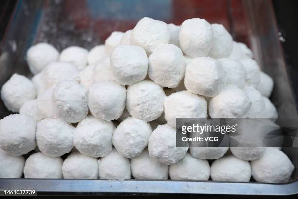 Yuanxiao, or glutinous rice balls, are sold at a street stall ahead of the Lantern Festival on January 30, 2023 in Xi'an, Shaanxi Province of China.