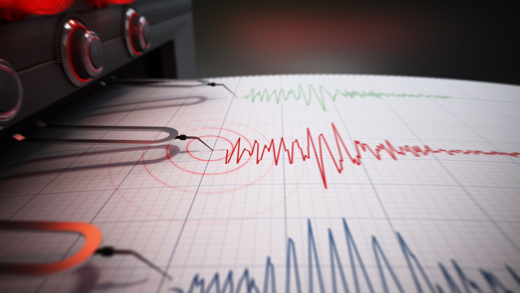 Seismograph printing seismic activity records of a severe earthquake Seismograph printing seismic activity records of a severe earthquake