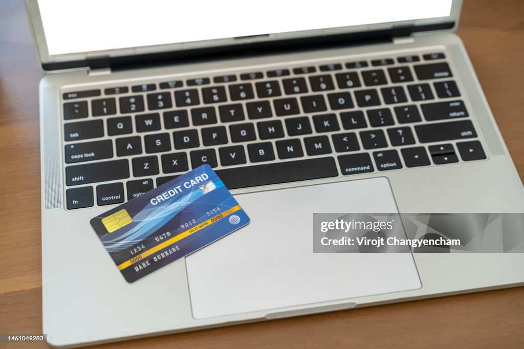 Credit Computer Credit Card With Computer Laptop On The Wooden Table High-Res Stock ...