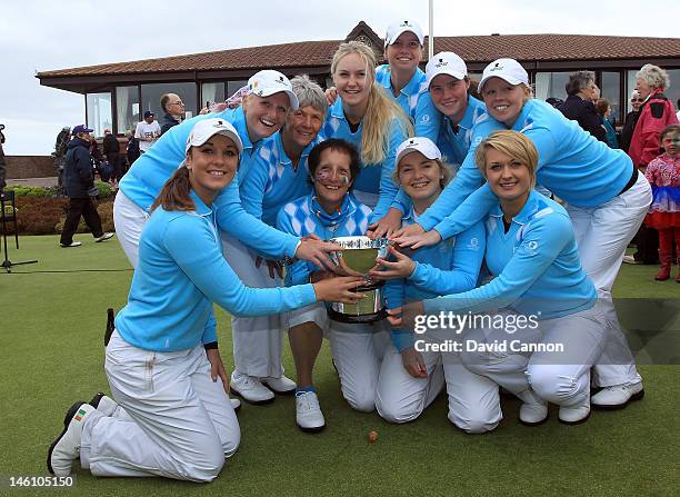 The victorious Great Britain and Ireland team with the Curtis Cup after their ten and a half to nine and a half win during the final day singles...