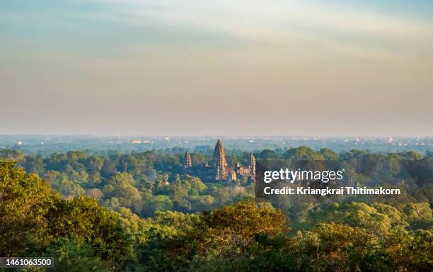 view of angkor wat from the distance. - angkor wat stock pictures, royalty-free photos & images