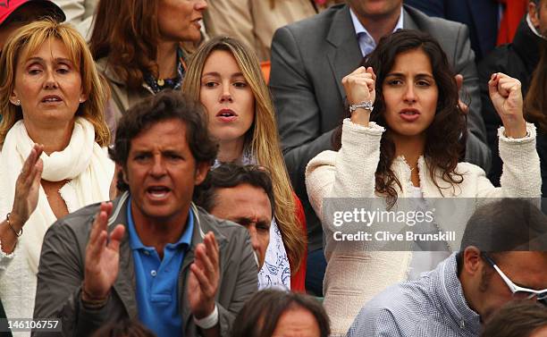 Rafael Nadal's mother Ana Maria Perera, sister Isabel Nadal and girlfriend Xisca Perello cheer during the men's singles final between Novak Djokovic...