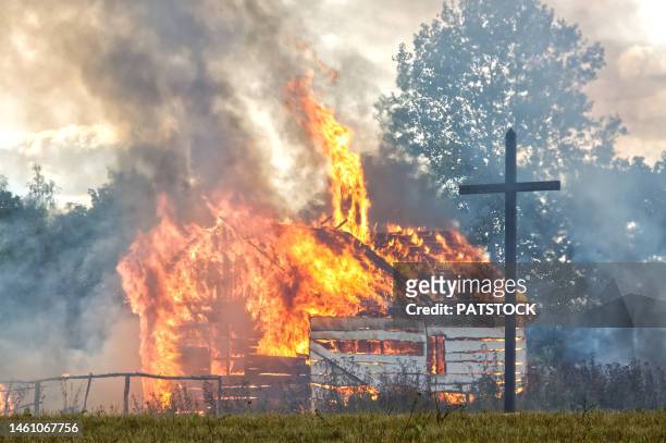 burning mock-up of a house. - cross fire stock pictures, royalty-free photos & images