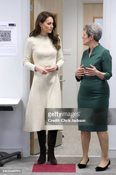 Catherine, Princess of Wales speaks with faculty during a visit to the University of Leeds to join students on the Childhood Studies programme on...