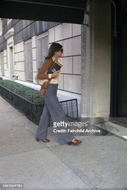Jacqueline Kennedy Onassis arriving home to her apartment building on October 15, 1973 in New York.