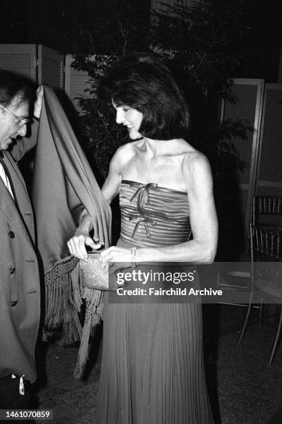 Jacqueline Kennedy Onassis attends the opening of the Costume Institute's latest show called 'Vanity Fair', a treasure trove of 500 exotic, whimsical...