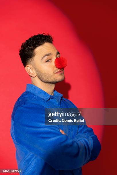 In this image released on February 1 Actor, Adam Thomas supports Red Nose Day 2023 by wearing the new Red Nose, which has been designed by Sir Jony...