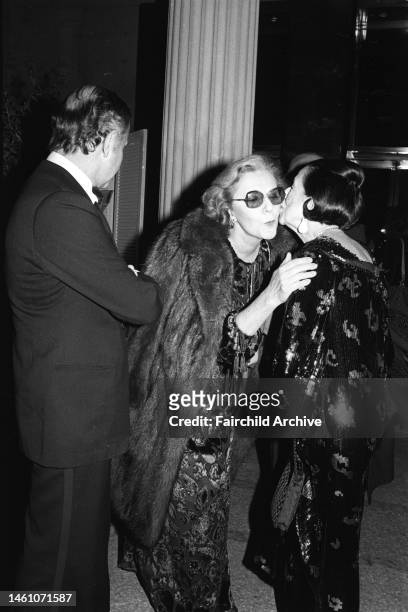 Slim Keith with Diana Vreeland wearing black and gold paillette Givenchy and Bill Blass attend the opening of the Costume Institute's latest show...