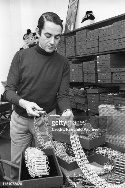 Portrait of American costume jewelry designer Kenneth Jay Lane with some of his designs on May 27, 1968...Article title: 'Inside Fashion