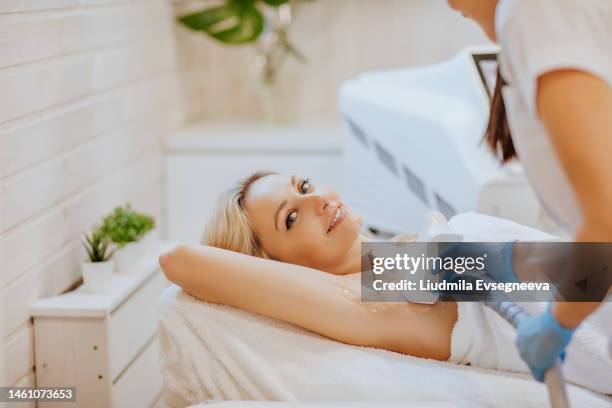 hair removal procedure - laser stock-fotos und bilder
