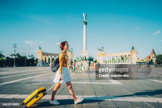 tourist woman visiting budapest - hero's square stock pictures, royalty-free photos & images
