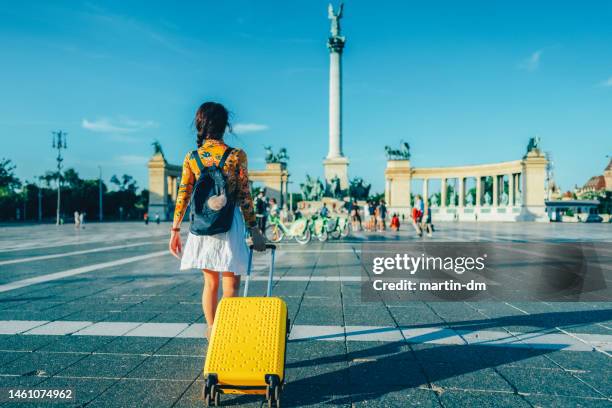 tourist woman visiting budapest - hero's square stock pictures, royalty-free photos & images