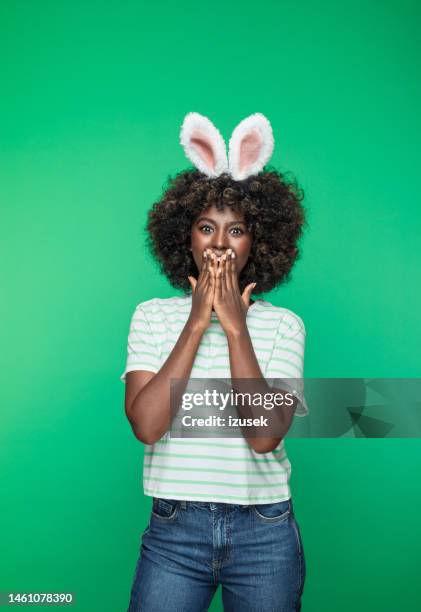 spring portrait of young woman with rabbit ears headband - rabbit costume stock pictures, royalty-free photos & images