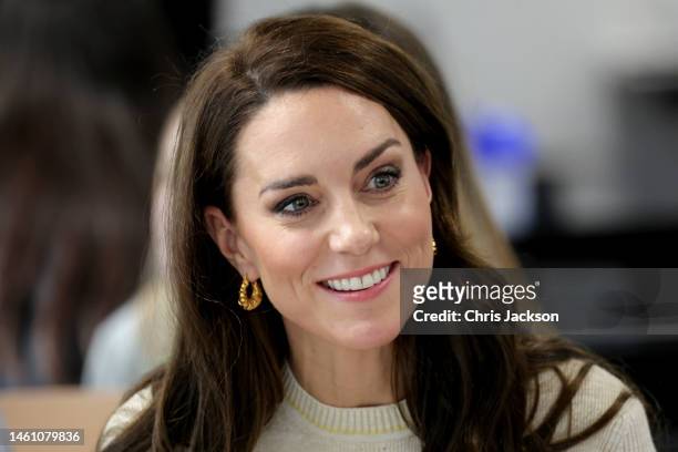 Catherine, Princess of Wales laughs with students on the Childhood Studies BA at the University of Leeds on January 31, 2023 in Leeds, England. The...