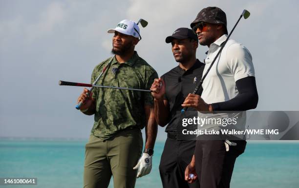 Players Eric Ebron, Patrick Peterson and Brice Butler look on during a practice round prior to the PIF Saudi International at Royal Greens Golf &...