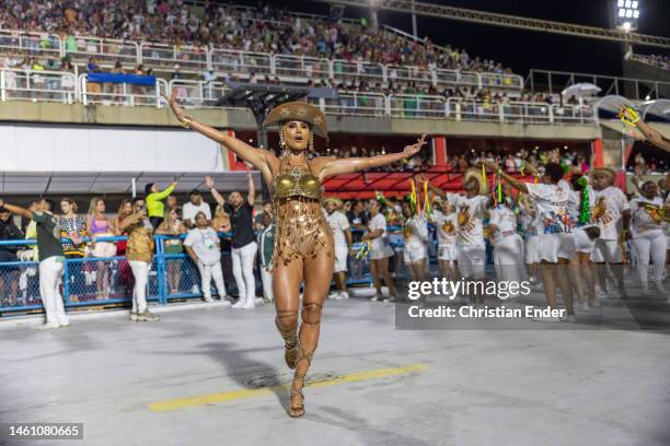 Natacha Horana, muse of Mocidade Independente de Padre Miguel, performs while samba dancers rehearse at the Marques de Sapucai sambodromo ahead of...