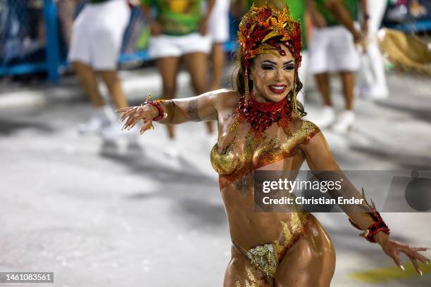 Leticia Guimaraes, muse of Mocidade Independente de Padre Miguel, performs while samba dancers rehearse at the Marques de Sapucai sambodromo ahead of...