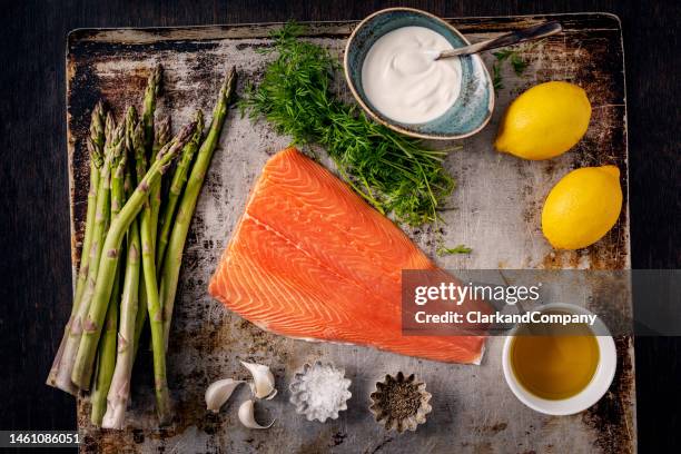 asparagus with baked salmon. - rustic salmon fillets stock pictures, royalty-free photos & images