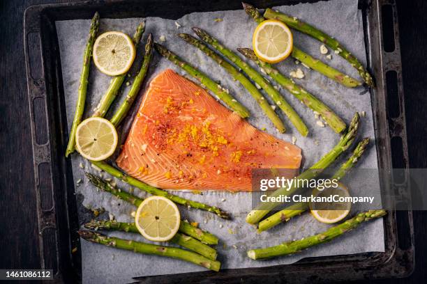 asparagus with baked salmon. - asparagus stock pictures, royalty-free photos & images