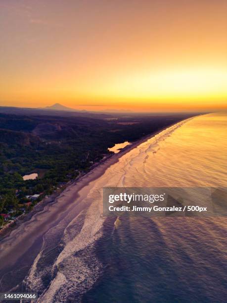 scenic view of beach against sky during sunset,el salvador - el salvador aerial stock pictures, royalty-free photos & images