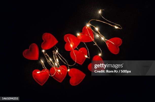 the magical glow of red hearts on black fabric view from above,ukraine - rom above stock pictures, royalty-free photos & images