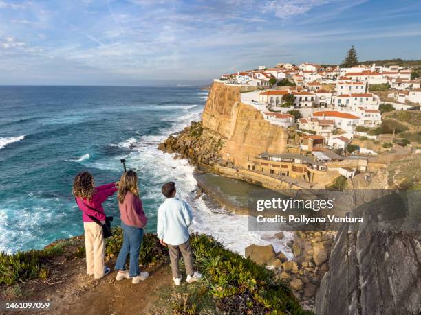 family taking photo at the observation point in azenhas do mar - azenhas do mar stock pictures, royalty-free photos & images