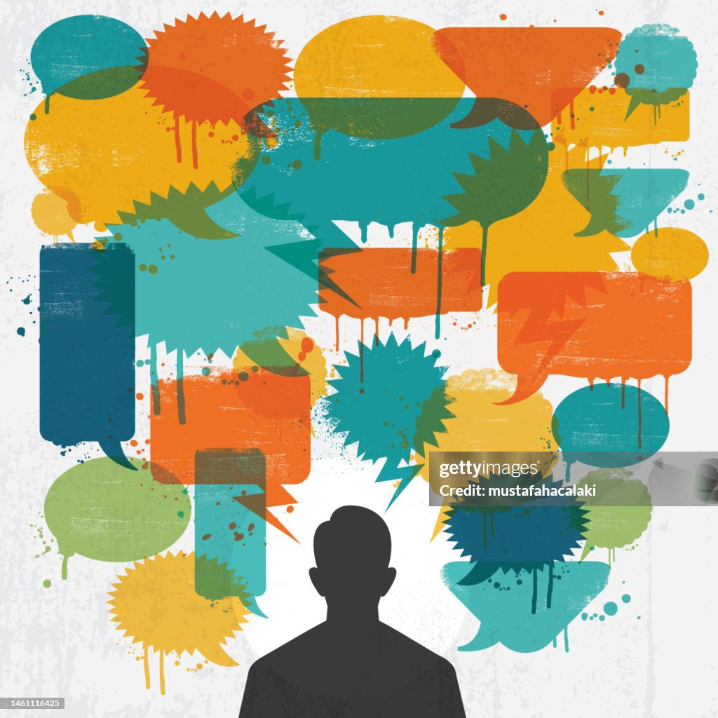 Man with colourful grunge speech bubbles over his head