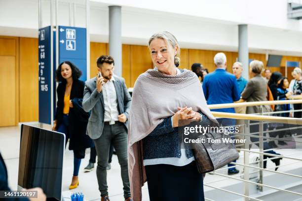 businesswoman arriving at conference - germany womens training press conference stock-fotos und bilder