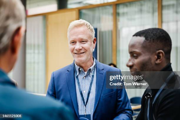 business conference participants discussing presentation - business introduction stock pictures, royalty-free photos & images