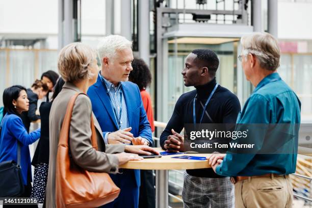 business conference participants discussing presentation - conference room stock-fotos und bilder