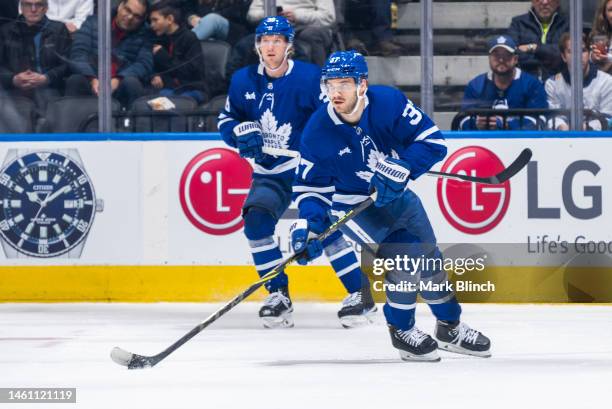 Timothy Liljegren and Rasmus Sandin of the Toronto Maple Leafs during the first period at the Scotiabank Arena on January 29, 2023 in Toronto,...