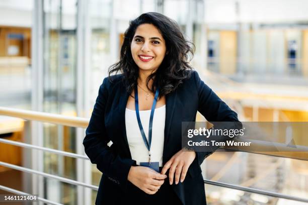 portrait of confident woman at busienss conference - middle eastern woman stock pictures, royalty-free photos & images