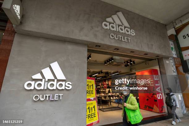 adidas outlet in hong kong - designer label stock pictures, royalty-free photos & images