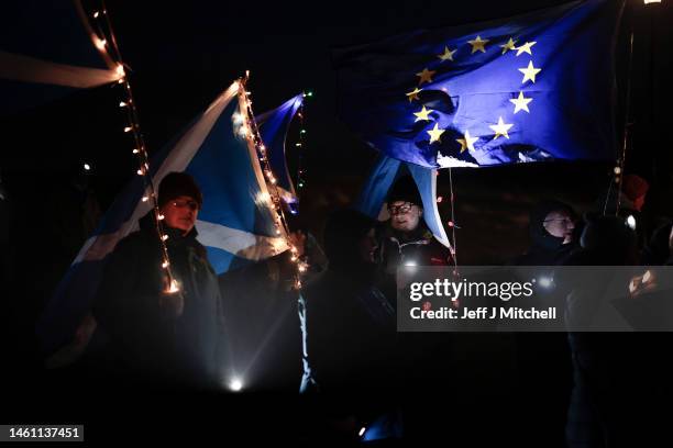 Anti-Brexit campaigners take part in a torchlight procession to the Scottish Parliament on the third anniversary of Brexit on January 31, 2023 in...