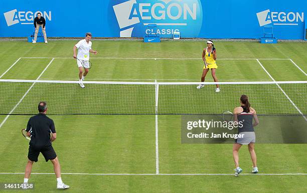 Andrew Castle and Anne Keothavong in action during an exhibition match with Jeremy Bates and Leyla Ogen during an exhibition match ahead of the AEGON...